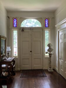 Front entrance with its beautiful stained glass side panels.